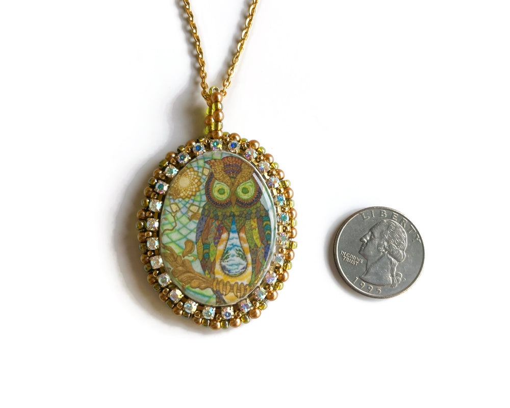 
            
                Load image into Gallery viewer, Abstract Resin Owl Beaded Cabochon Pendant Necklace
            
        